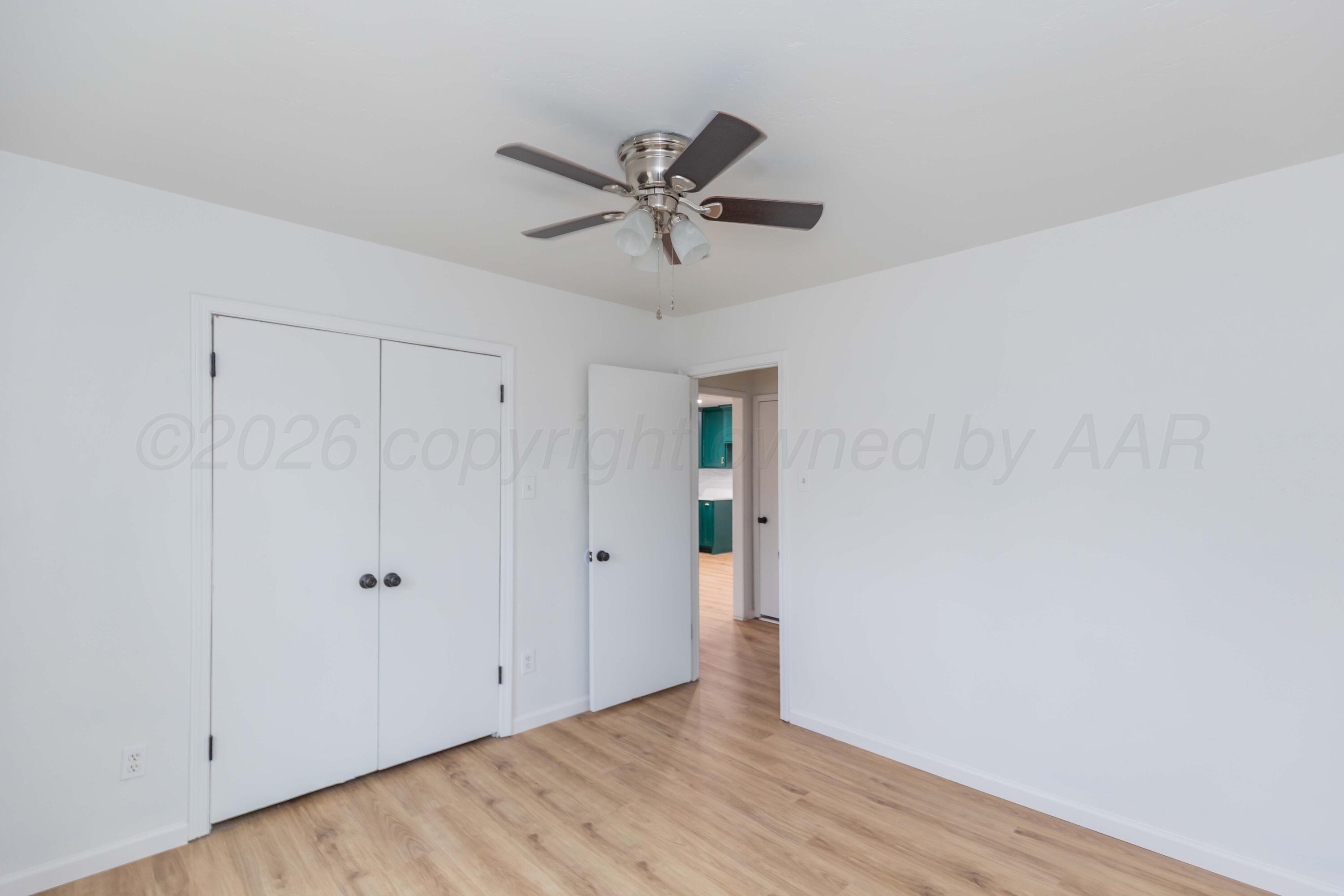 205 South Forest Street Amarillo, TX 79106 - Photo 26 of 29 a view of a livingroom with a ceiling fan and wooden floor