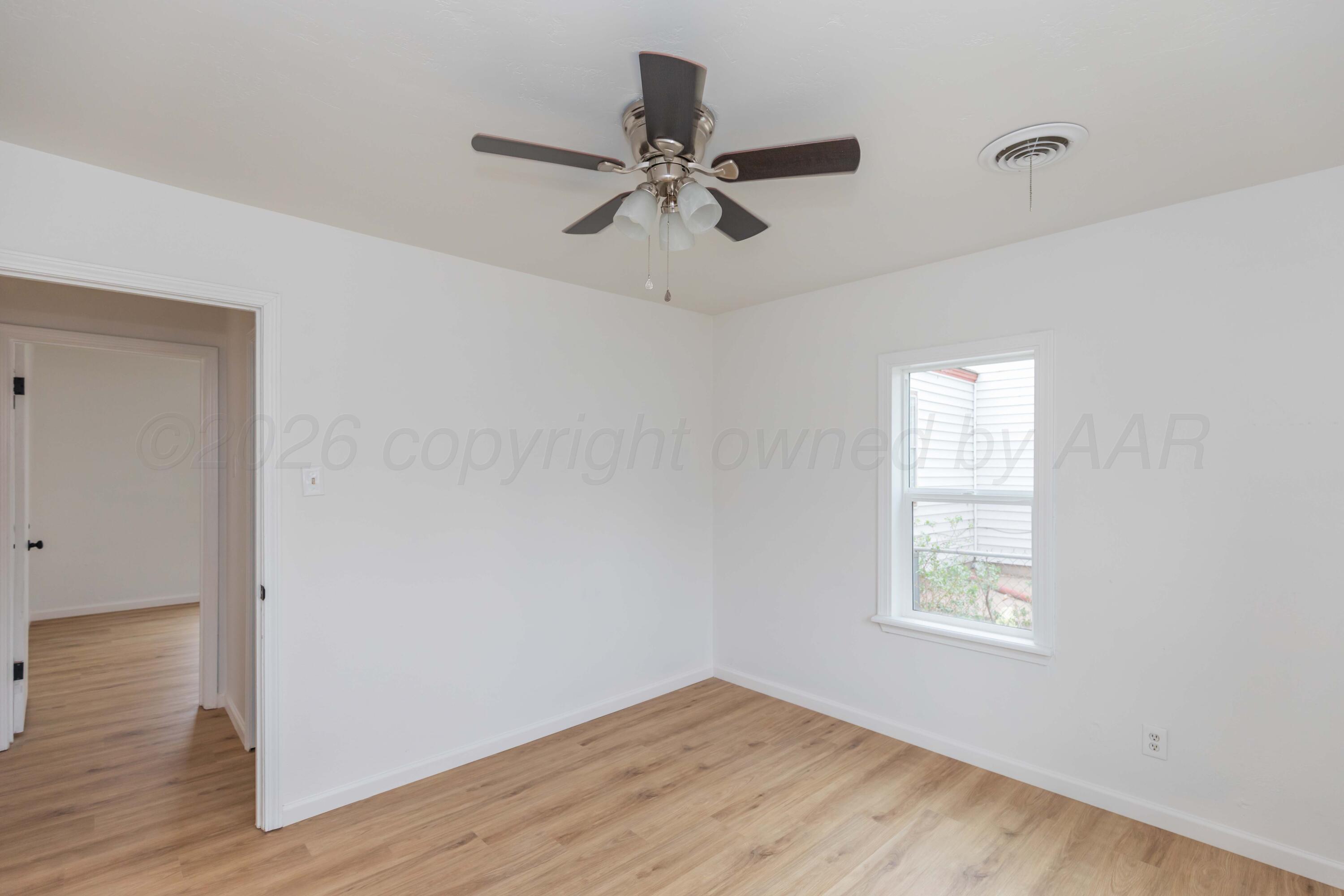 205 South Forest Street Amarillo, TX 79106 - Photo 27 of 29 a view of an entryway with wooden floor and windows