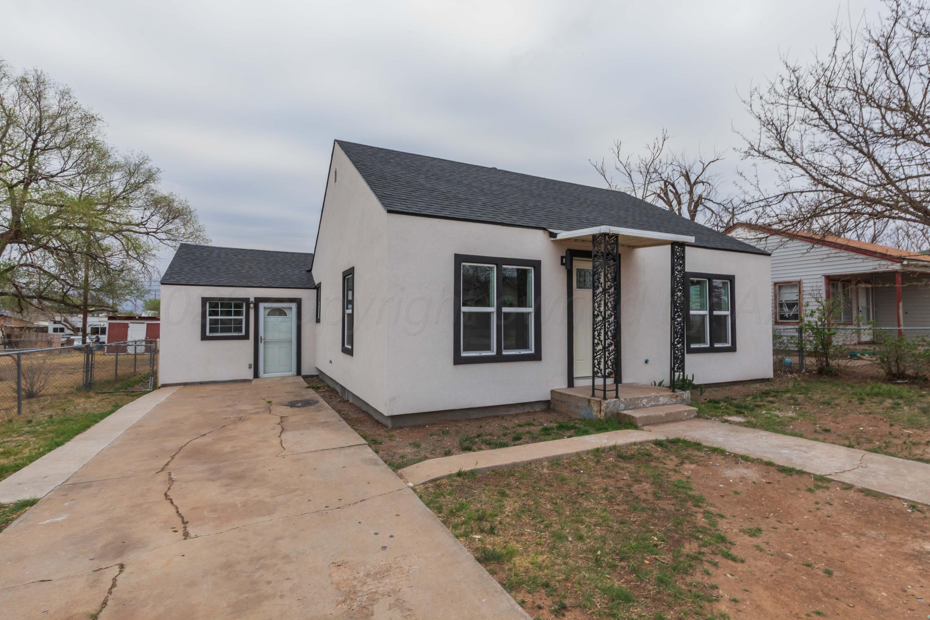 205 South Forest Street Amarillo, TX 79106 - Photo 29 of 29 a front view of a house with a yard and garage