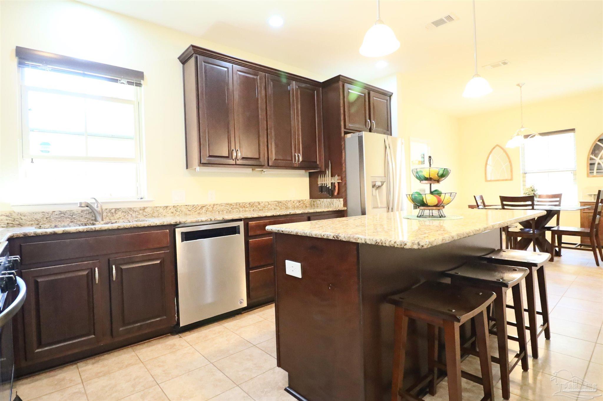 3934 Fielding Court Pace, FL 32571 - Photo 13 of 49 a kitchen with a sink and cabinets