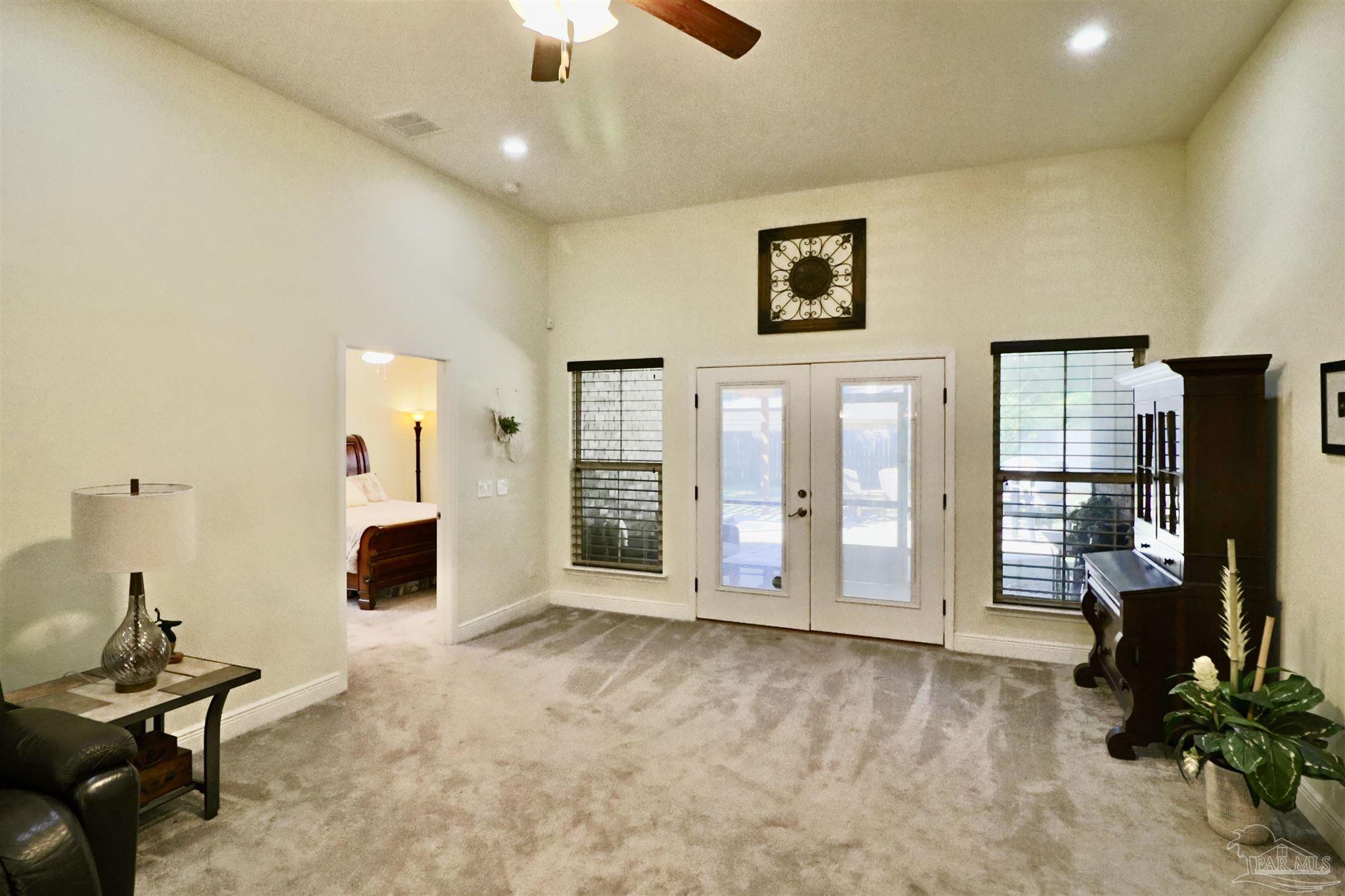 3934 Fielding Court Pace, FL 32571 - Photo 20 of 49 a view of a livingroom with furniture and a ceiling fan