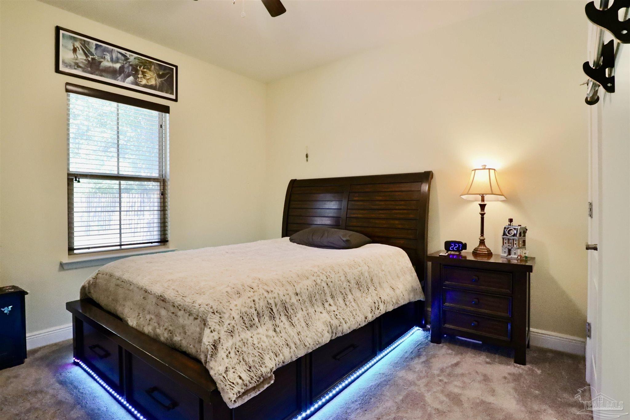 3934 Fielding Court Pace, FL 32571 - Photo 35 of 49 a bedroom with a bed and window