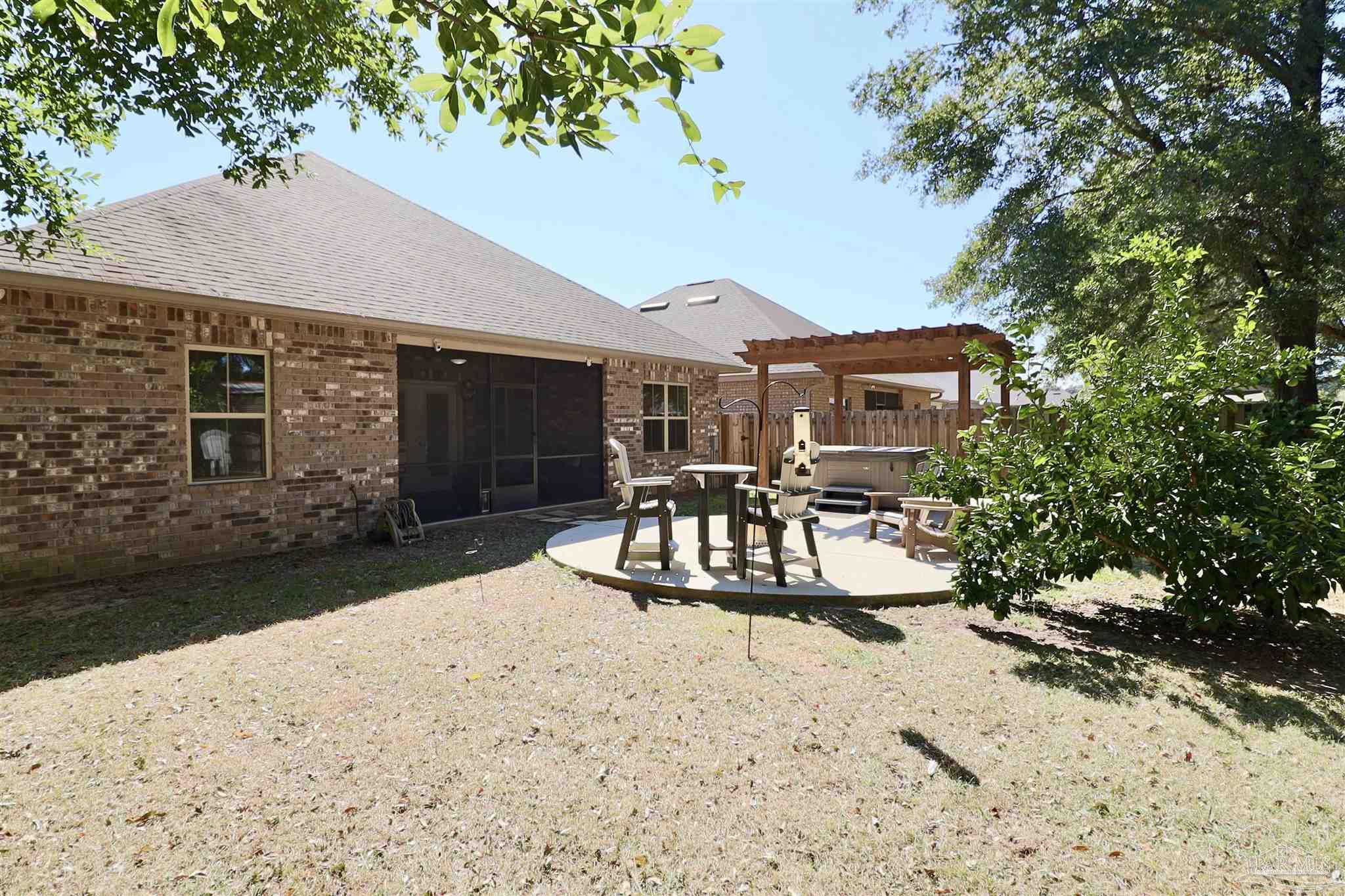 3934 Fielding Court Pace, FL 32571 - Photo 45 of 49 a view of a house with backyard and sitting area