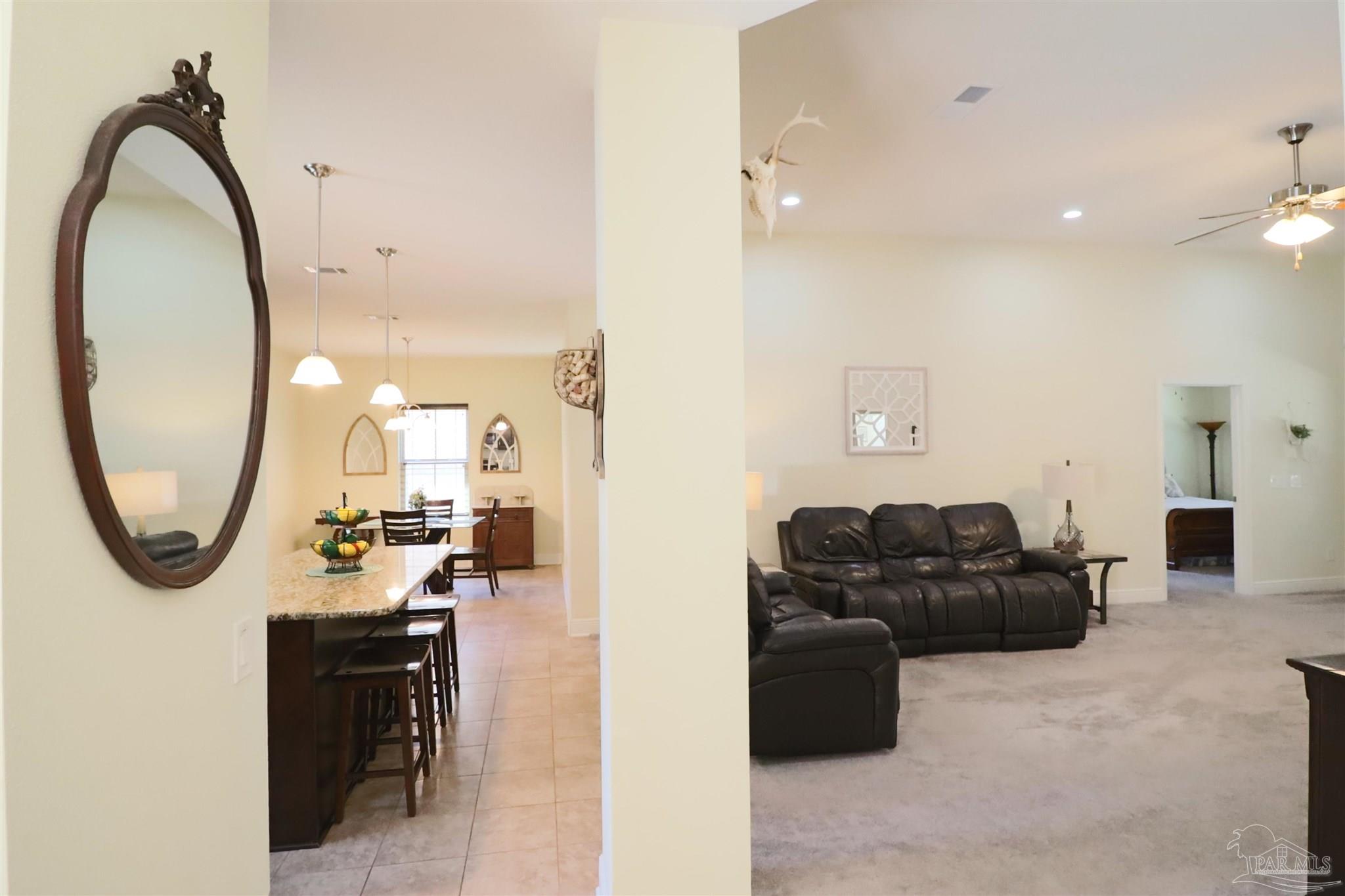 3934 Fielding Court Pace, FL 32571 - Photo 10 of 49 a living room with furniture and a mirror
