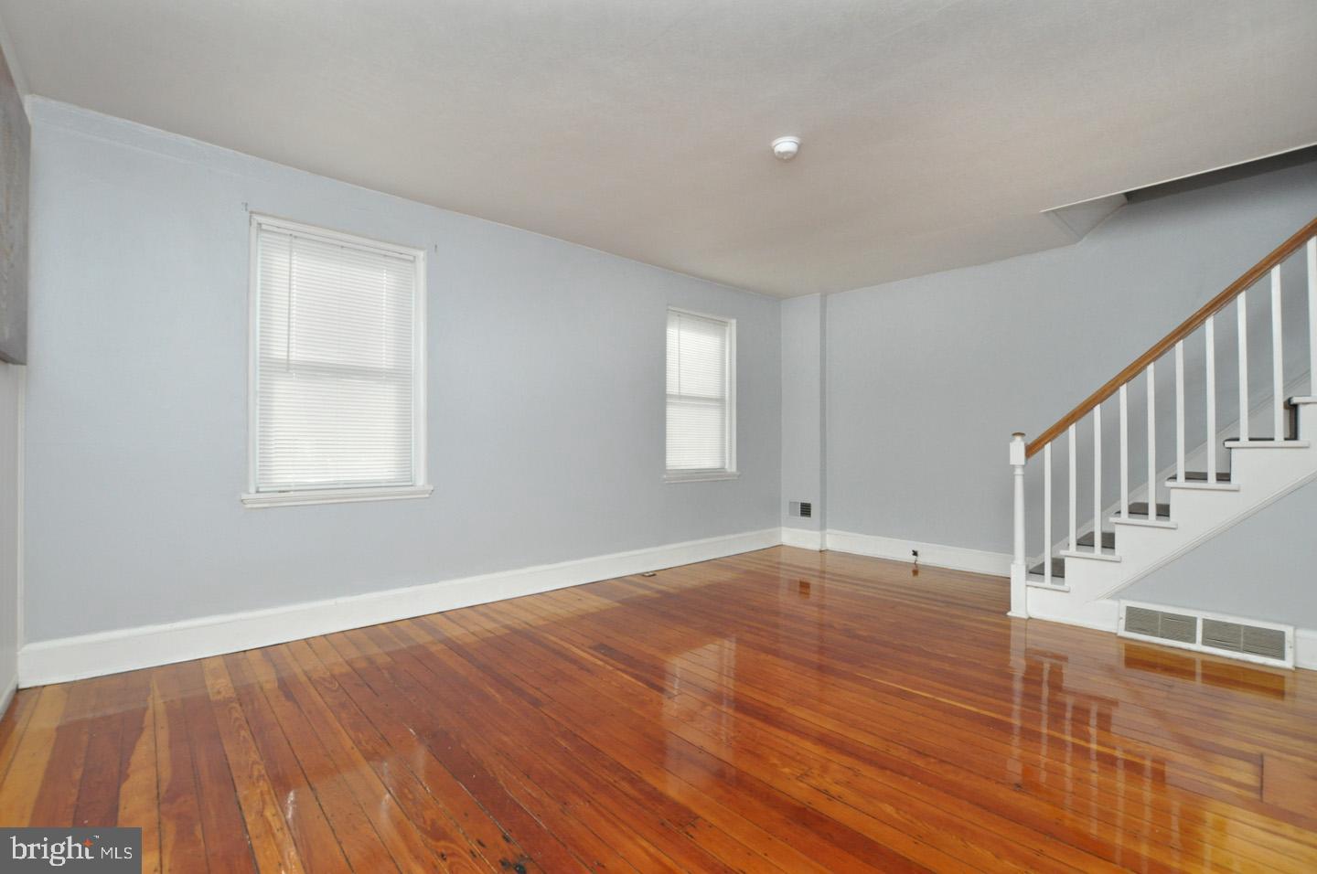 3069 South Chesapeake Road Camden, NJ 08104 - Photo 15 of 30 a view of an empty room with wooden floor and a window