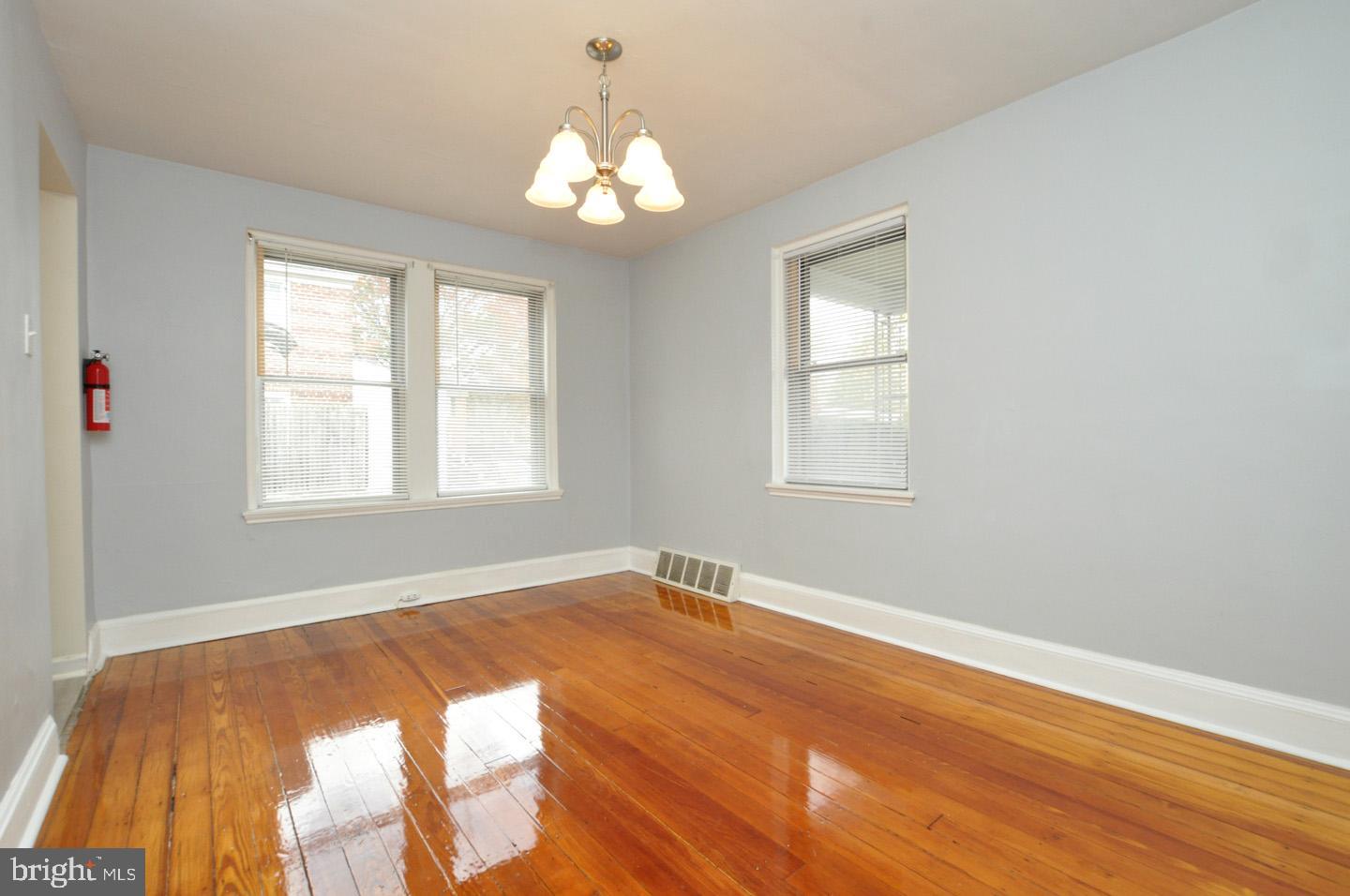 3069 South Chesapeake Road Camden, NJ 08104 - Photo 17 of 30 a view of an empty room with wooden floor and a window
