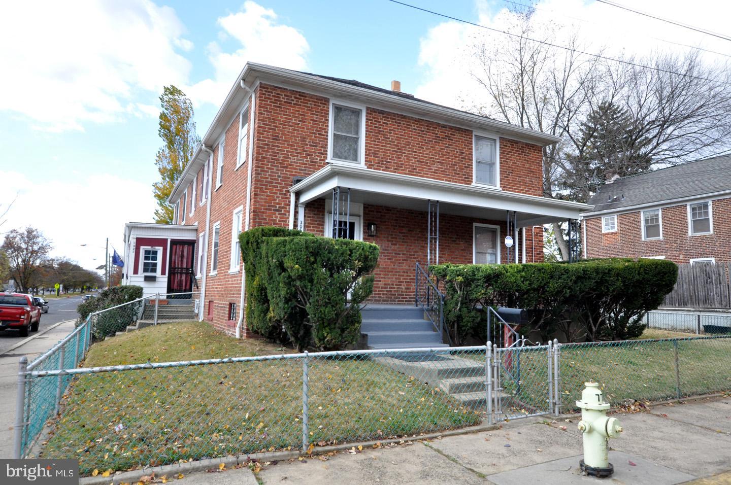 3069 South Chesapeake Road Camden, NJ 08104 - Photo 2 of 30 a front view of a house with a garden and plants