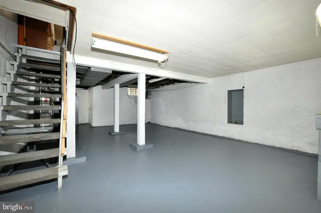 a view of an empty room with stairs