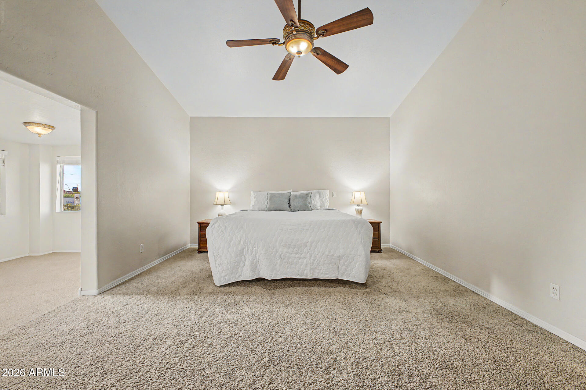 1124 North Robin Lane Mesa, AZ 85213 - Photo 11 of 87 a bedroom with a bed and a ceiling fan