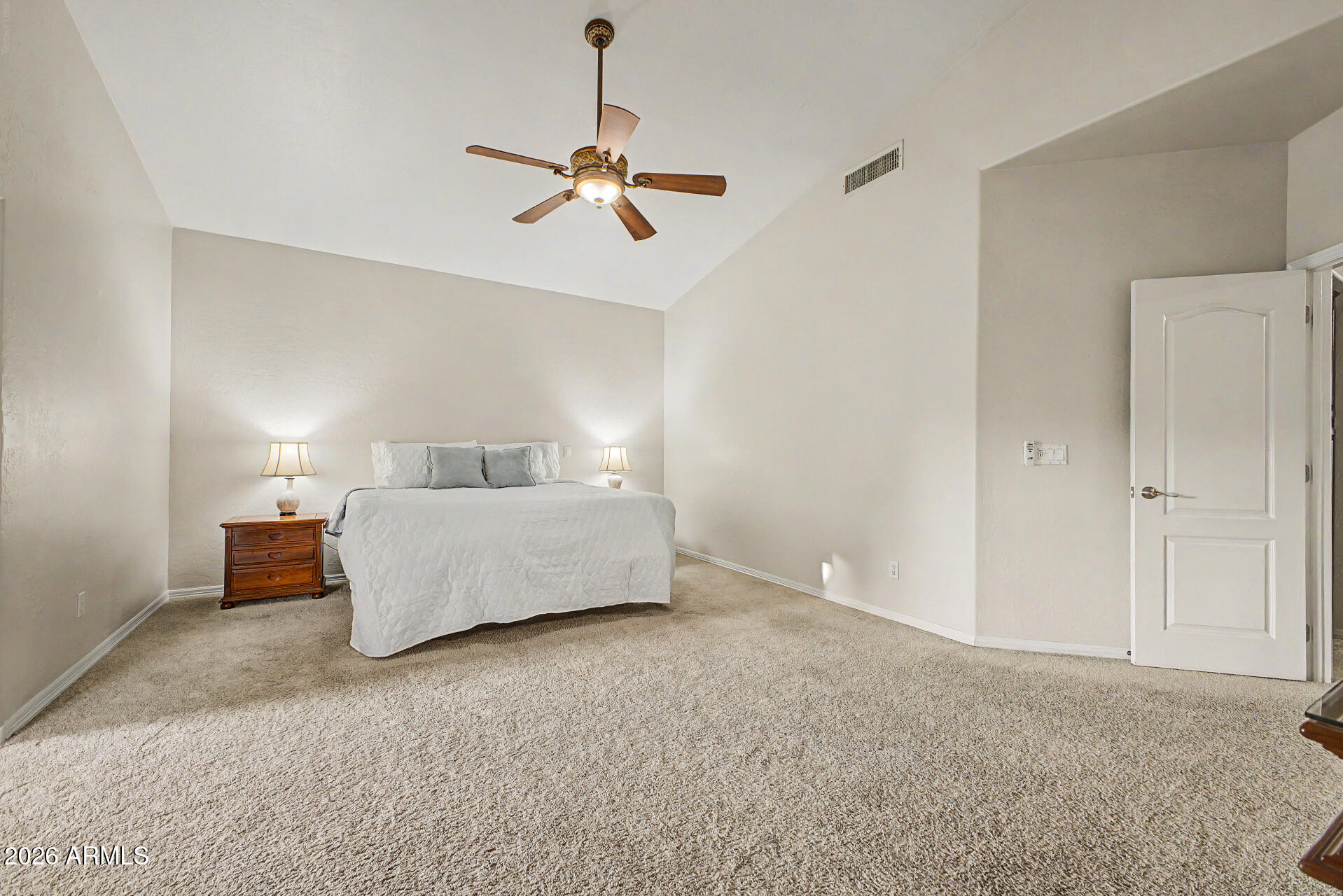 1124 North Robin Lane Mesa, AZ 85213 - Photo 12 of 87 a bedroom with a bed and cabinets