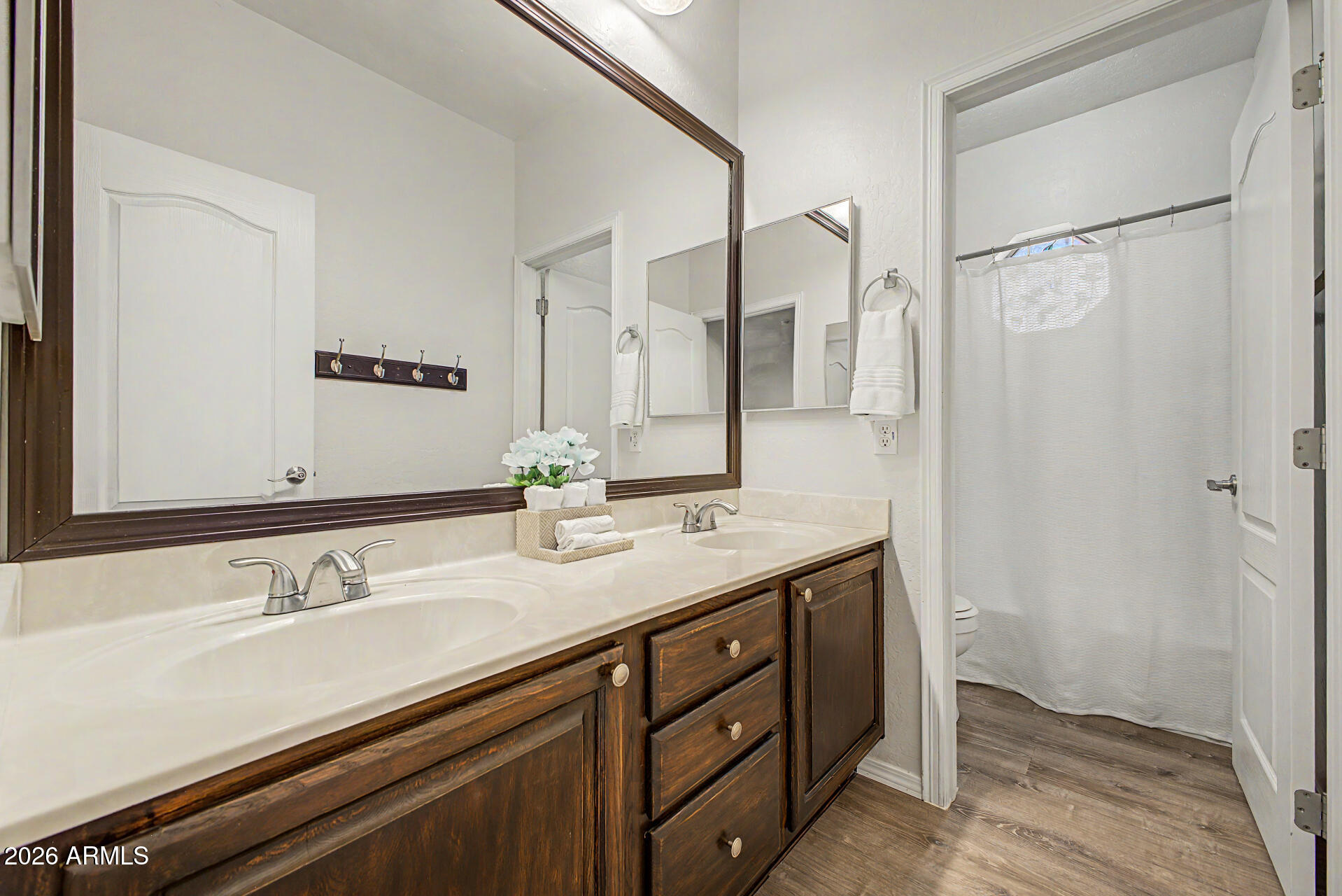1124 North Robin Lane Mesa, AZ 85213 - Photo 19 of 87 a bathroom with a double vanity sink and a mirror