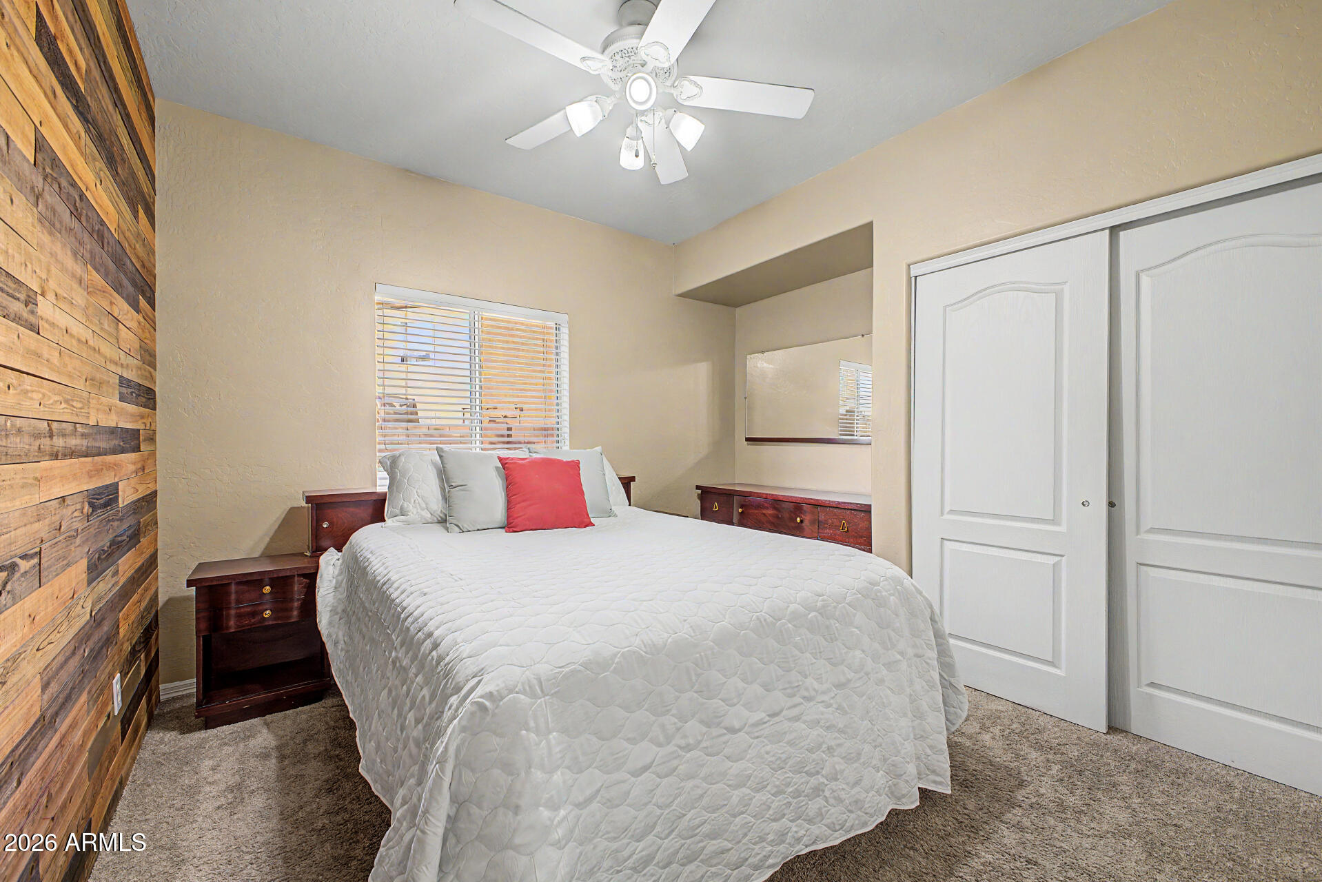 1124 North Robin Lane Mesa, AZ 85213 - Photo 21 of 87 a bedroom with a large bed and a chandelier fan