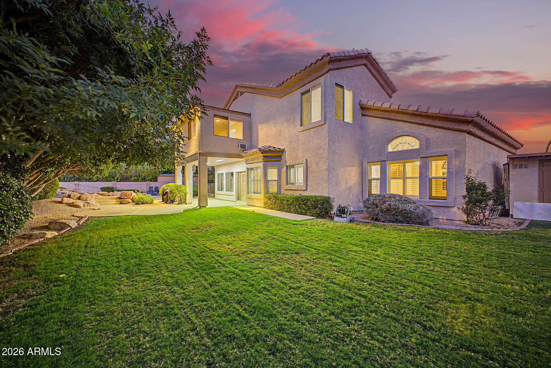 1124 North Robin Lane Mesa, AZ 85213 - Photo 24 of 87 a front view of a house with garden