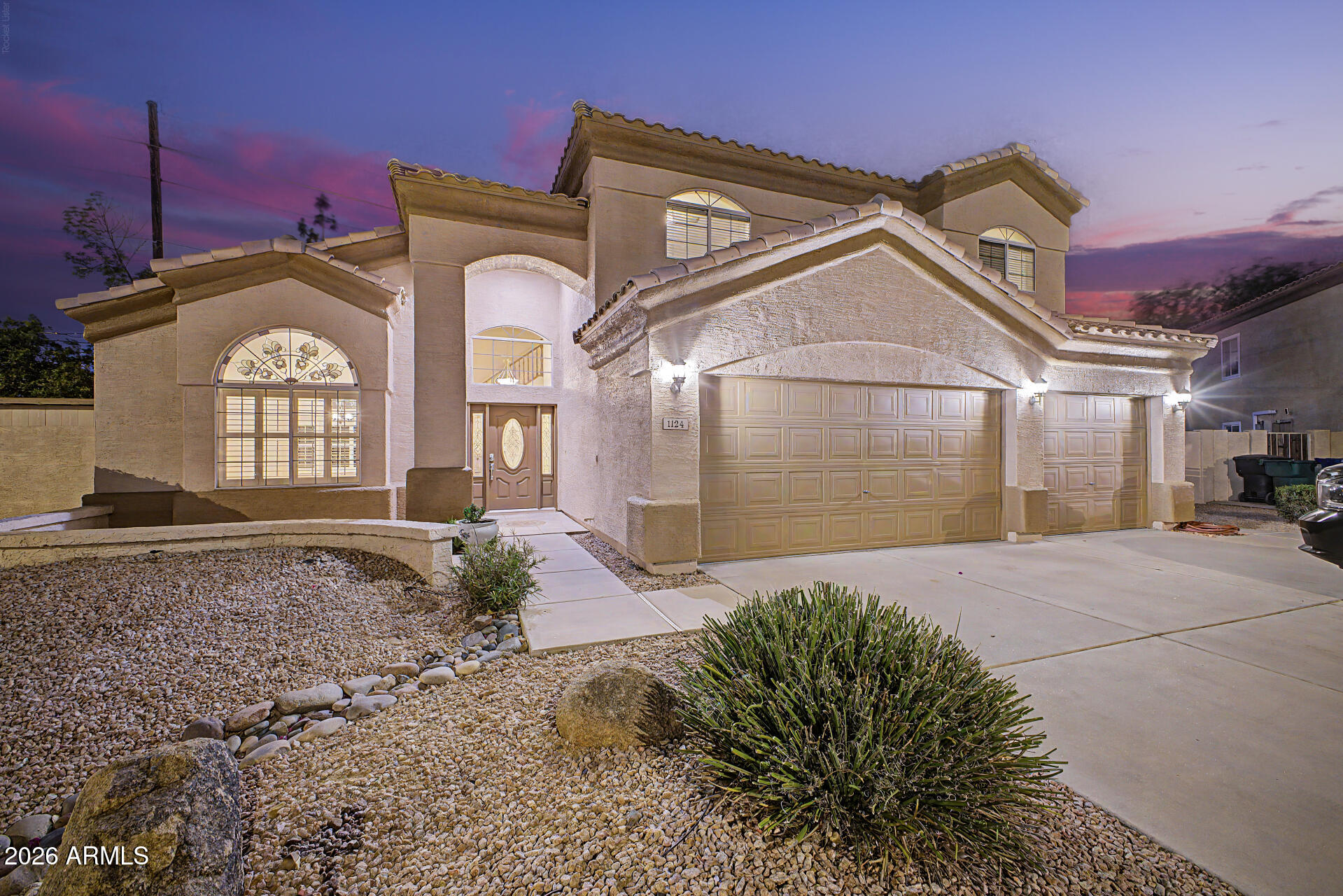 1124 North Robin Lane Mesa, AZ 85213 - Photo 35 of 87 a front view of a house