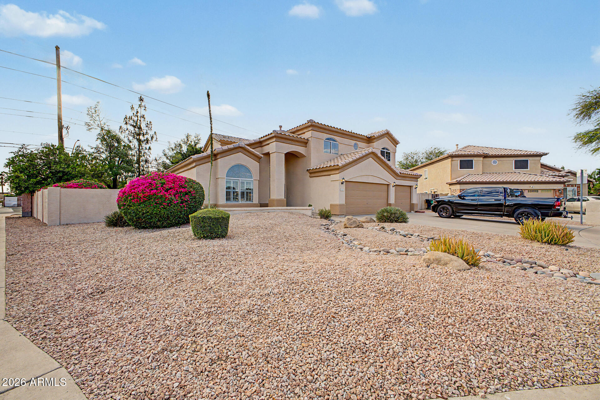 1124 North Robin Lane Mesa, AZ 85213 - Photo 39 of 87 a view of a house with a yard