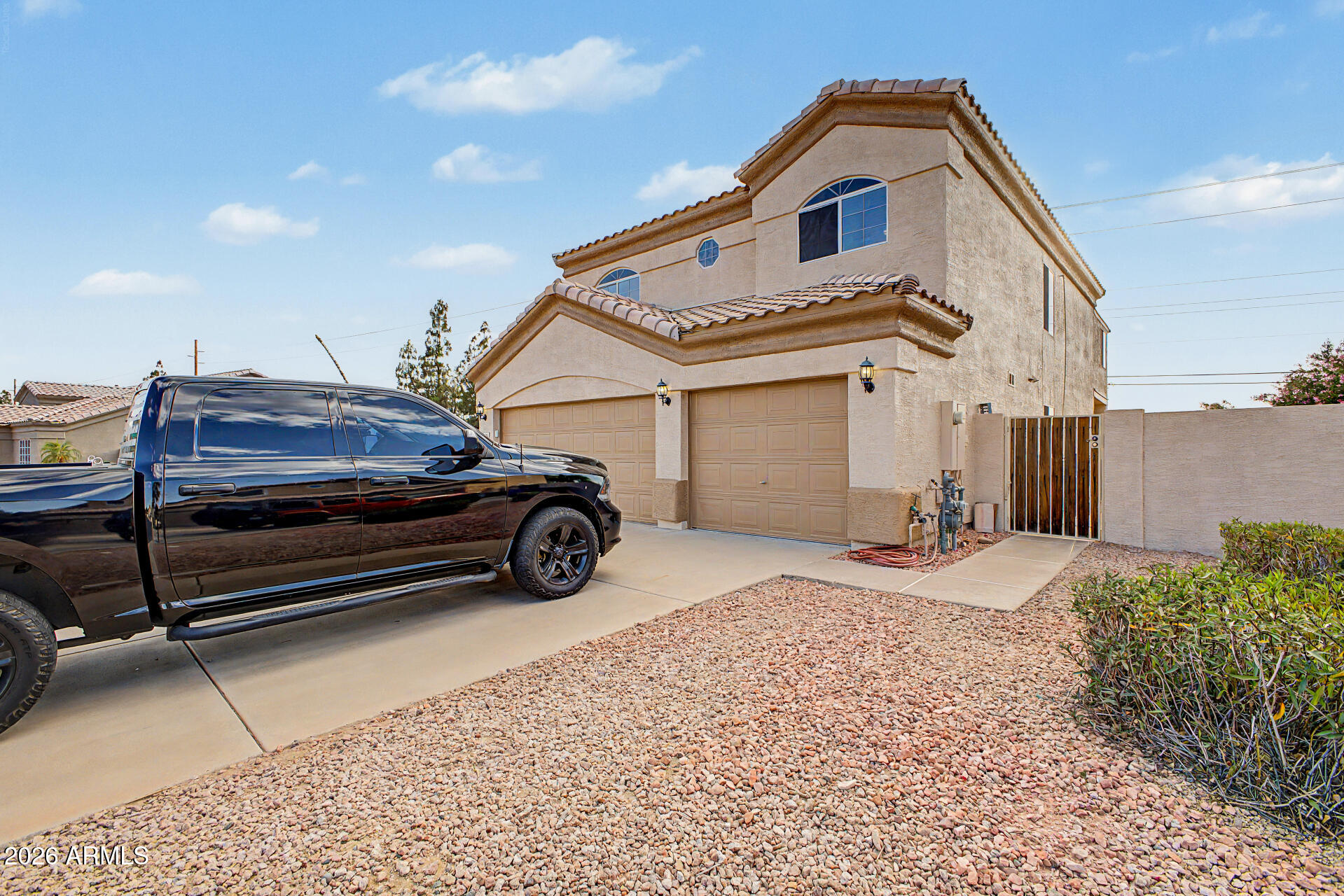 1124 North Robin Lane Mesa, AZ 85213 - Photo 43 of 87 a view of a car park in front of house