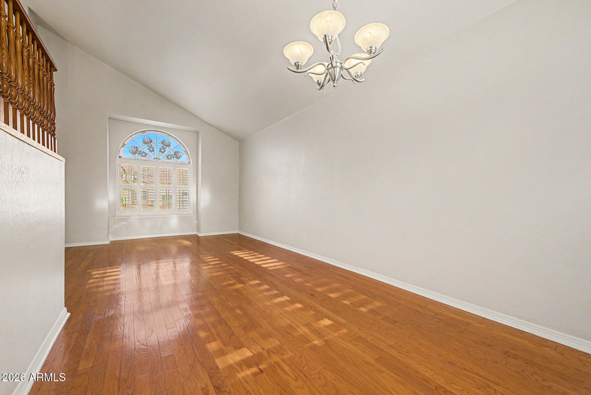 1124 North Robin Lane Mesa, AZ 85213 - Photo 51 of 87 wooden floor in an empty room with a window
