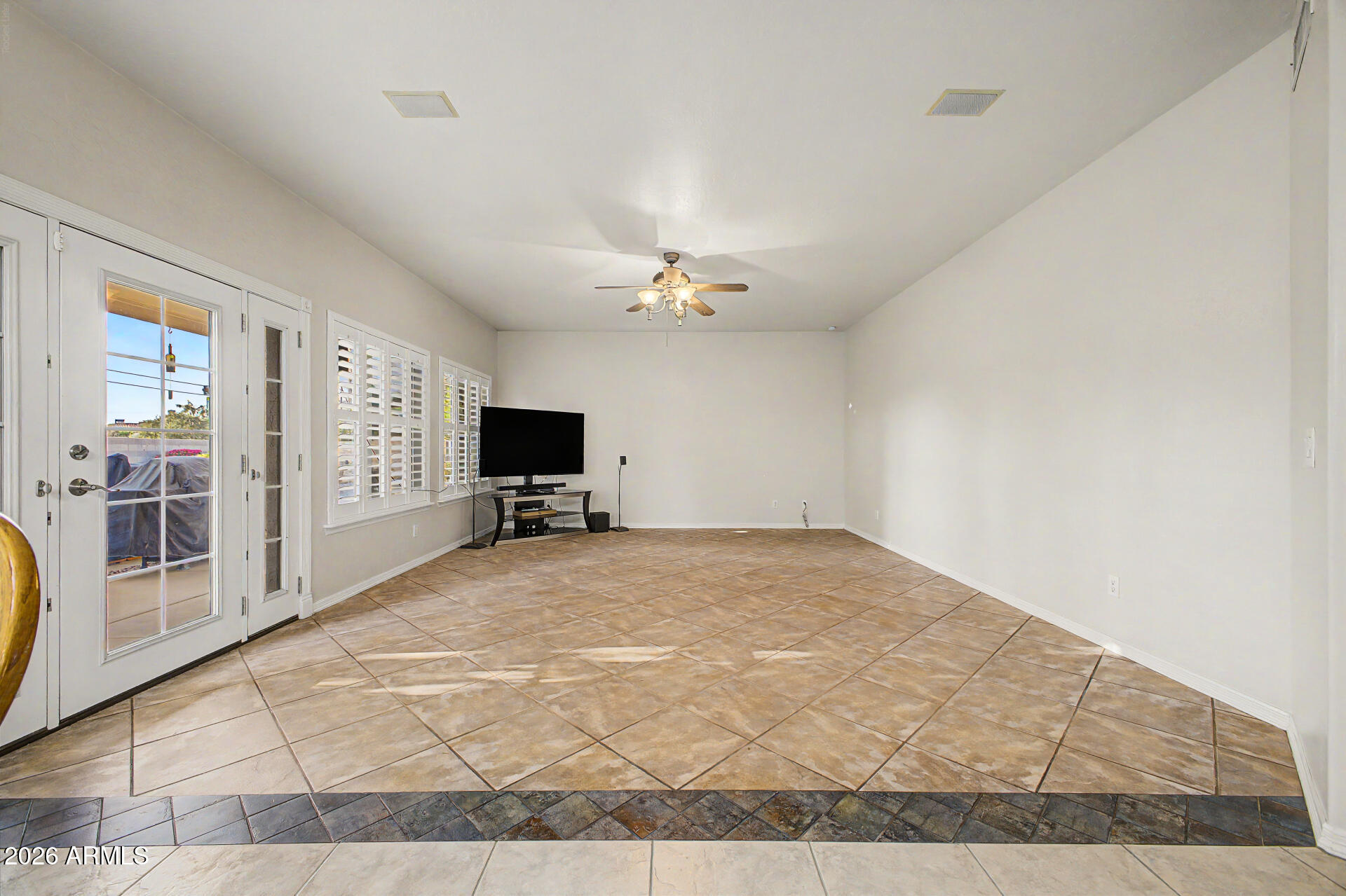 1124 North Robin Lane Mesa, AZ 85213 - Photo 52 of 87 a view of a livingroom with a flat screen tv