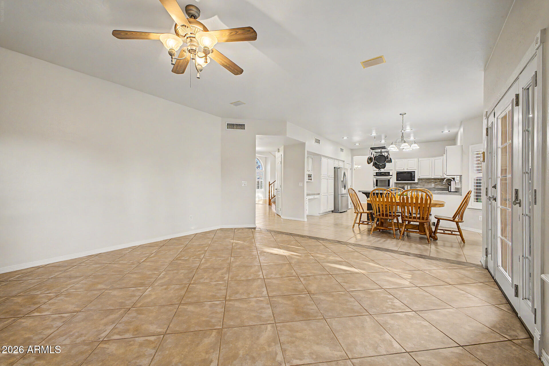 1124 North Robin Lane Mesa, AZ 85213 - Photo 55 of 87 a view of a livingroom with furniture and a chandelier fan