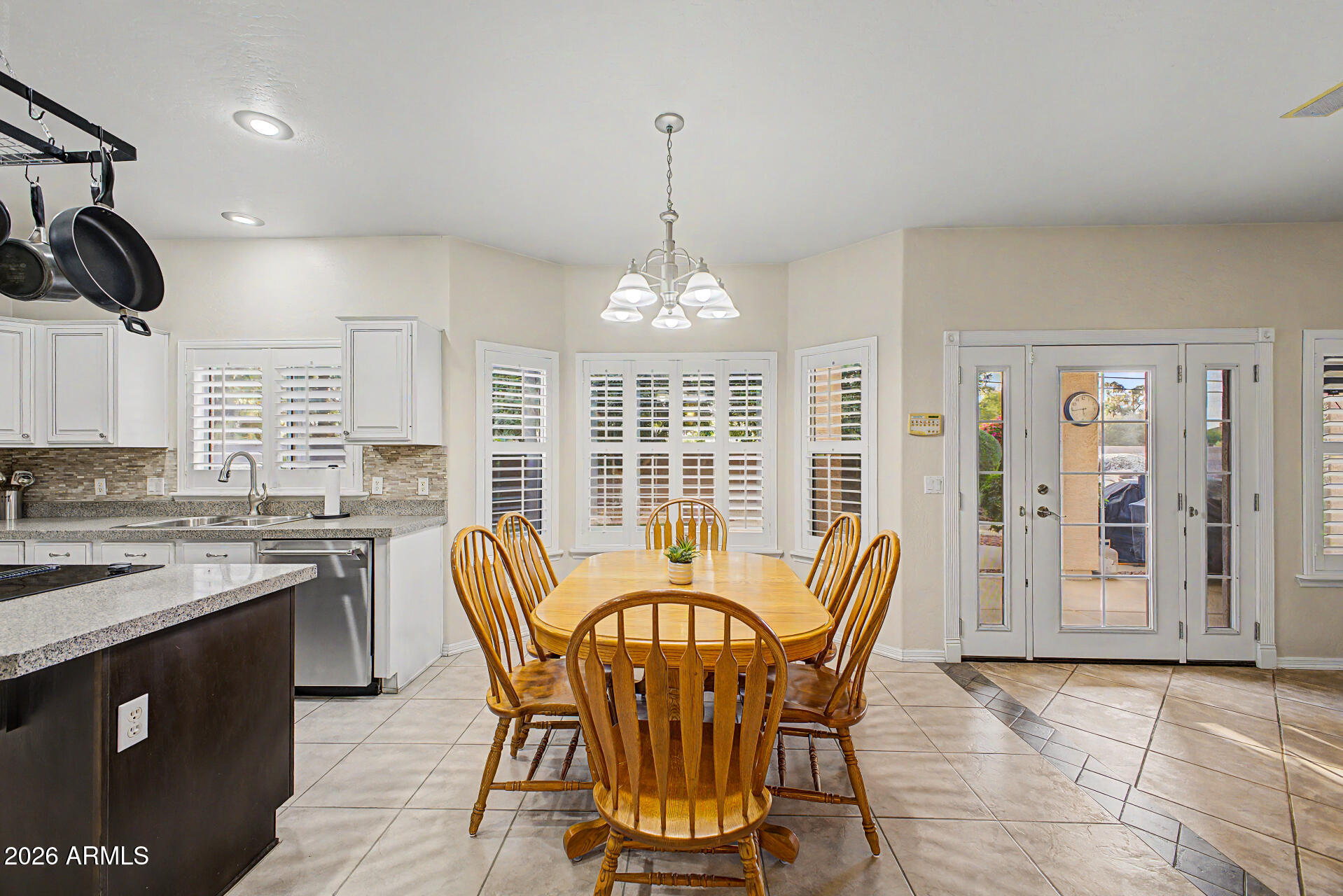 1124 North Robin Lane Mesa, AZ 85213 - Photo 56 of 87 a view of a dining room with furniture window and outside view