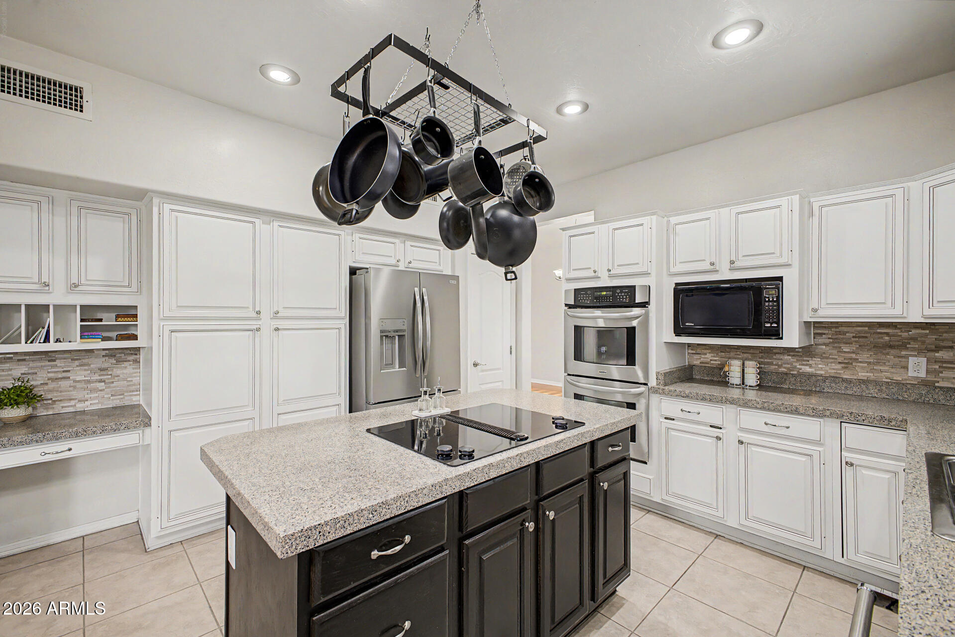 1124 North Robin Lane Mesa, AZ 85213 - Photo 57 of 87 a kitchen with a sink dishwasher and a stove with wooden floor