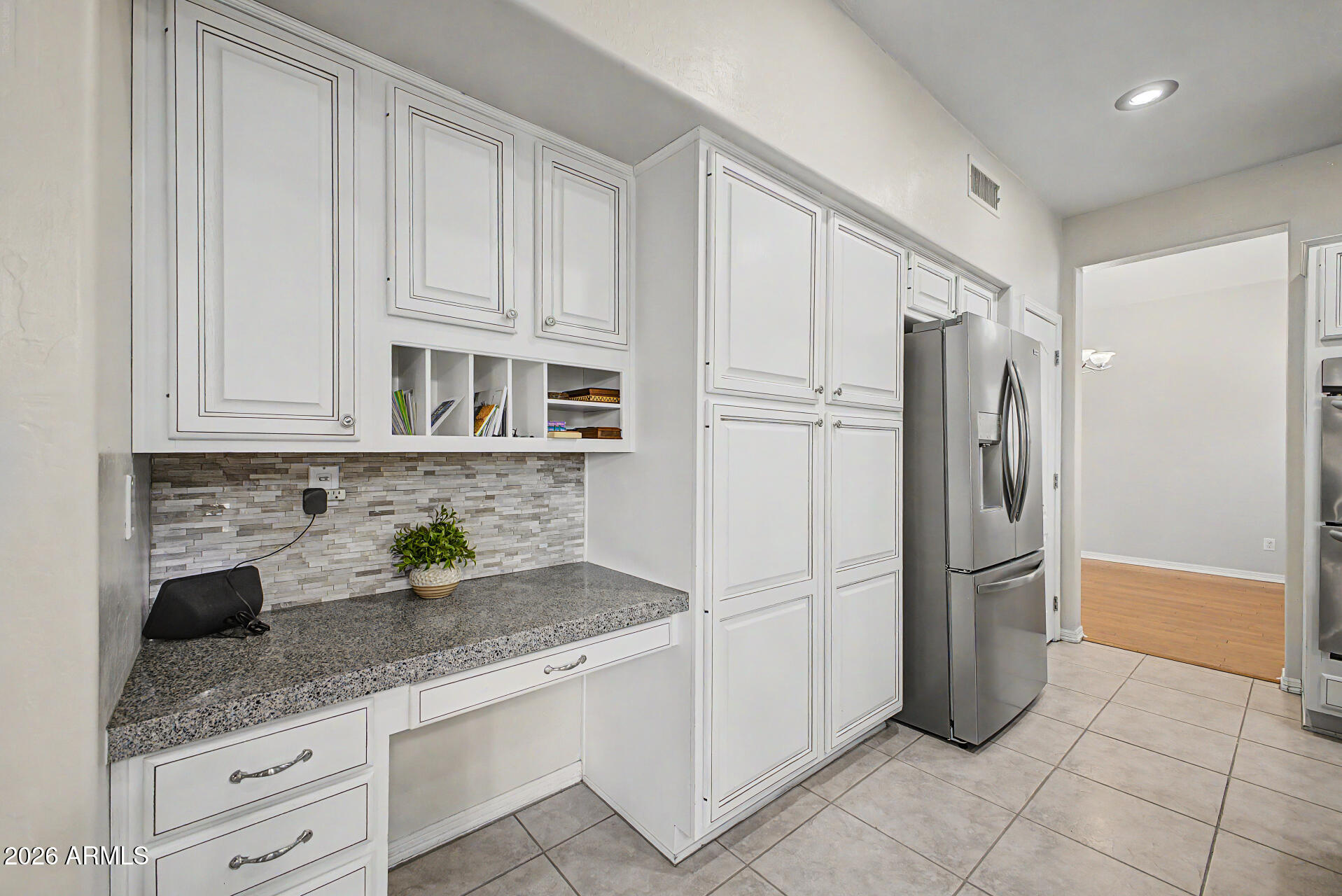 1124 North Robin Lane Mesa, AZ 85213 - Photo 62 of 87 a kitchen with stainless steel appliances granite countertop a refrigerator and a sink