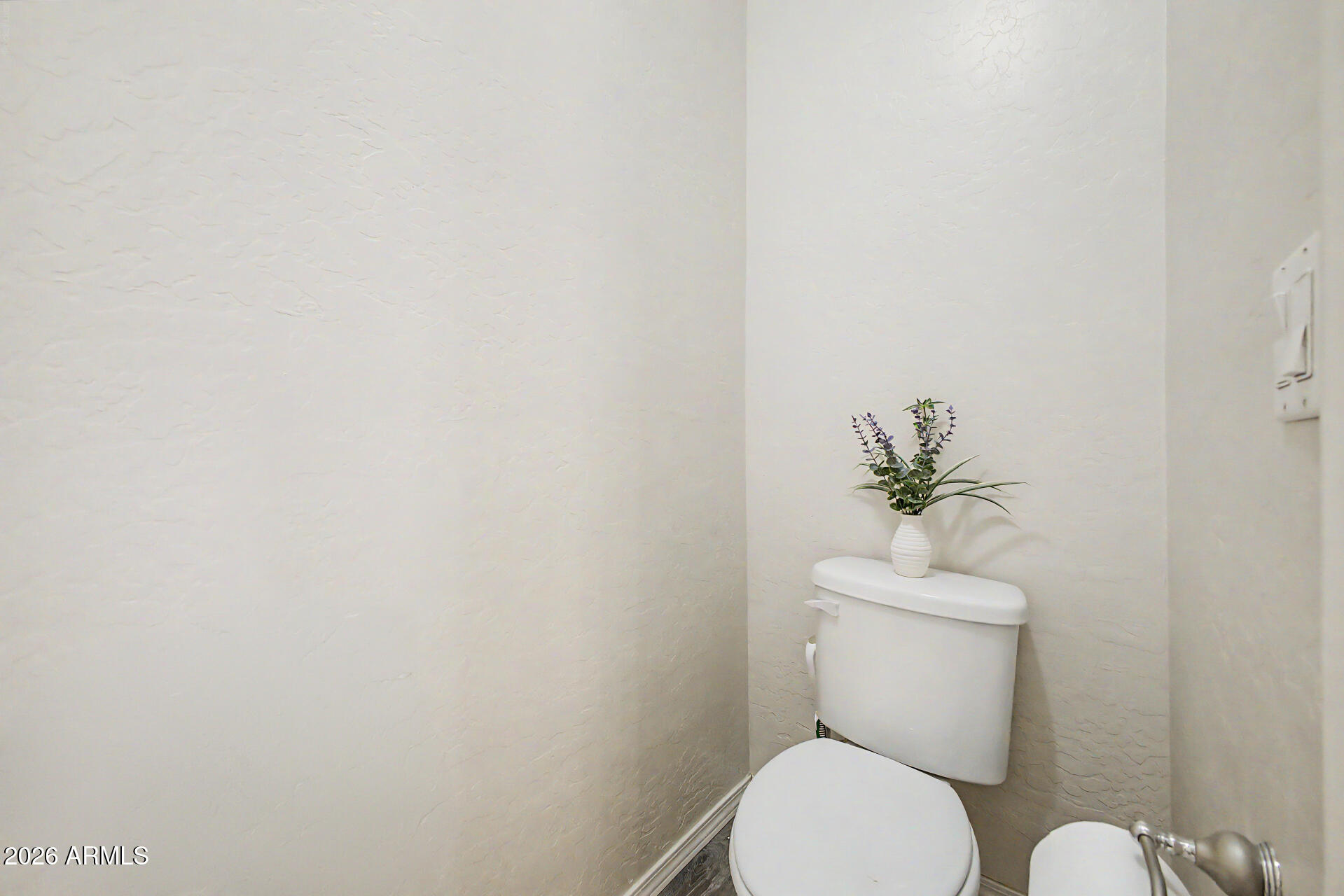 1124 North Robin Lane Mesa, AZ 85213 - Photo 66 of 87 a white toilet sitting next to a white walls