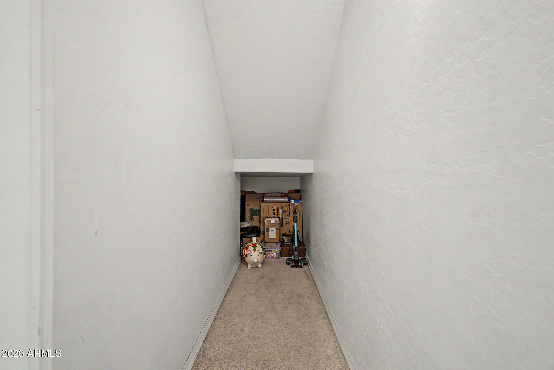1124 North Robin Lane Mesa, AZ 85213 - Photo 69 of 87 a view of a hallway with wooden floor and a white door