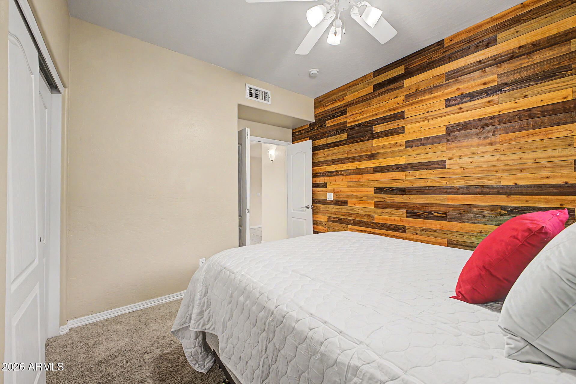 1124 North Robin Lane Mesa, AZ 85213 - Photo 70 of 87 a bedroom with a bed and a chandelier