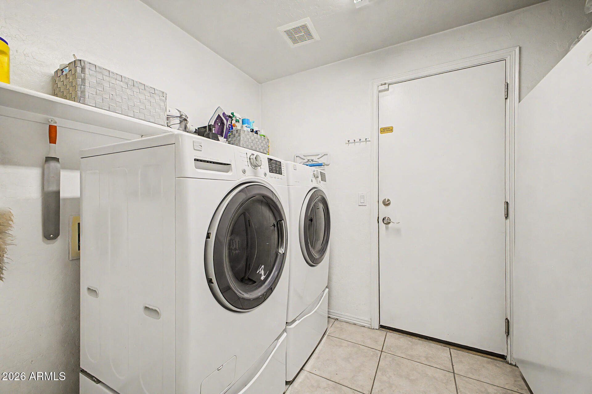 1124 North Robin Lane Mesa, AZ 85213 - Photo 76 of 87 a utility room with dryer and washer