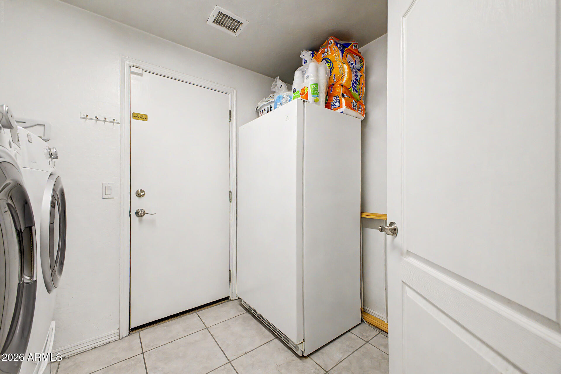1124 North Robin Lane Mesa, AZ 85213 - Photo 77 of 87 Spacious laundry room