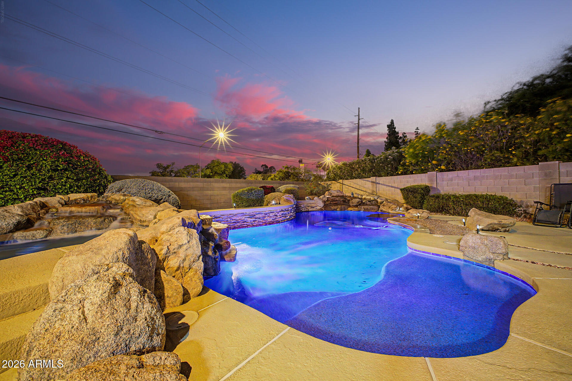 1124 North Robin Lane Mesa, AZ 85213 - Photo 79 of 87 a view of a swimming pool with outdoor seating