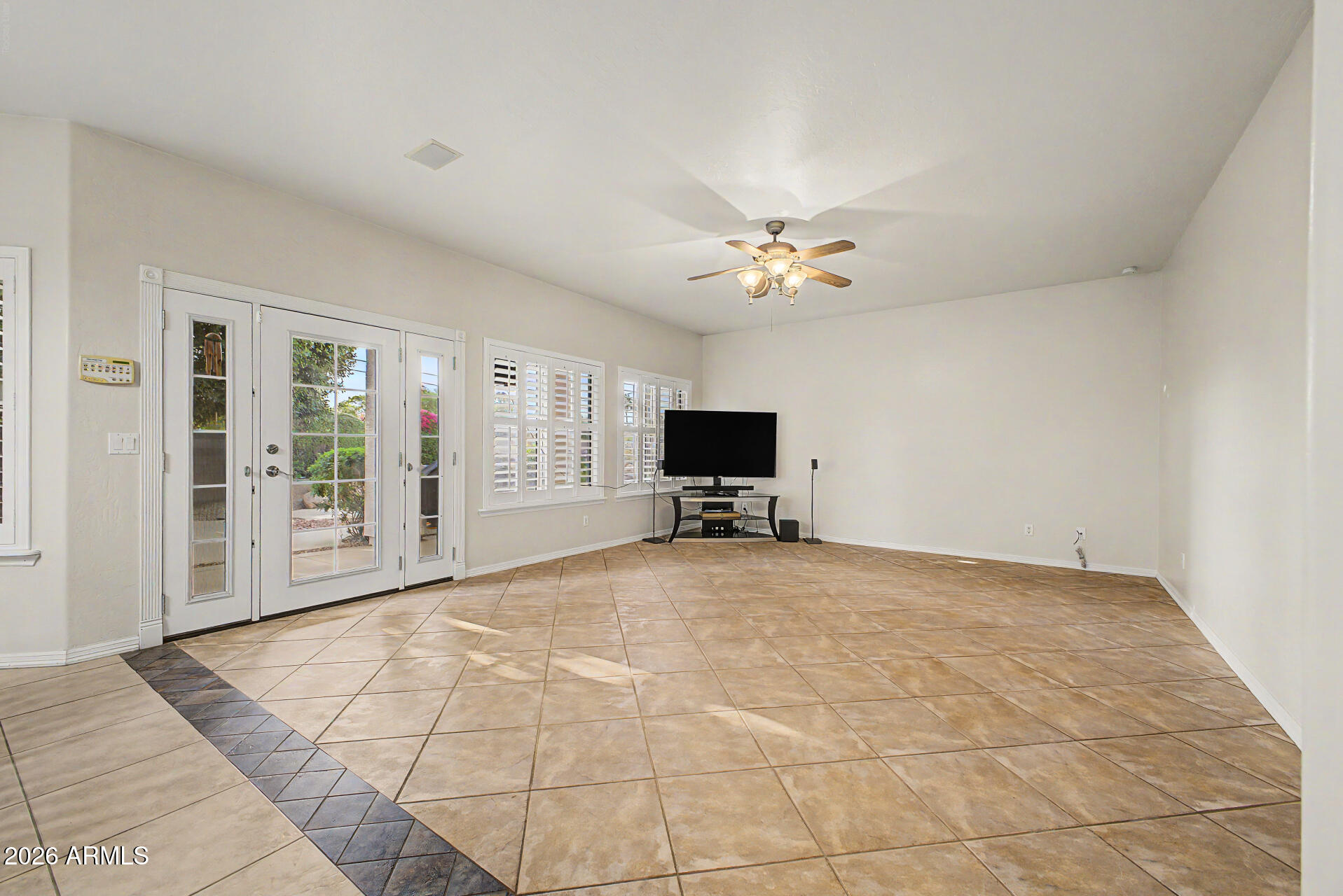 1124 North Robin Lane Mesa, AZ 85213 - Photo 9 of 87 a view of a livingroom with a flat screen tv