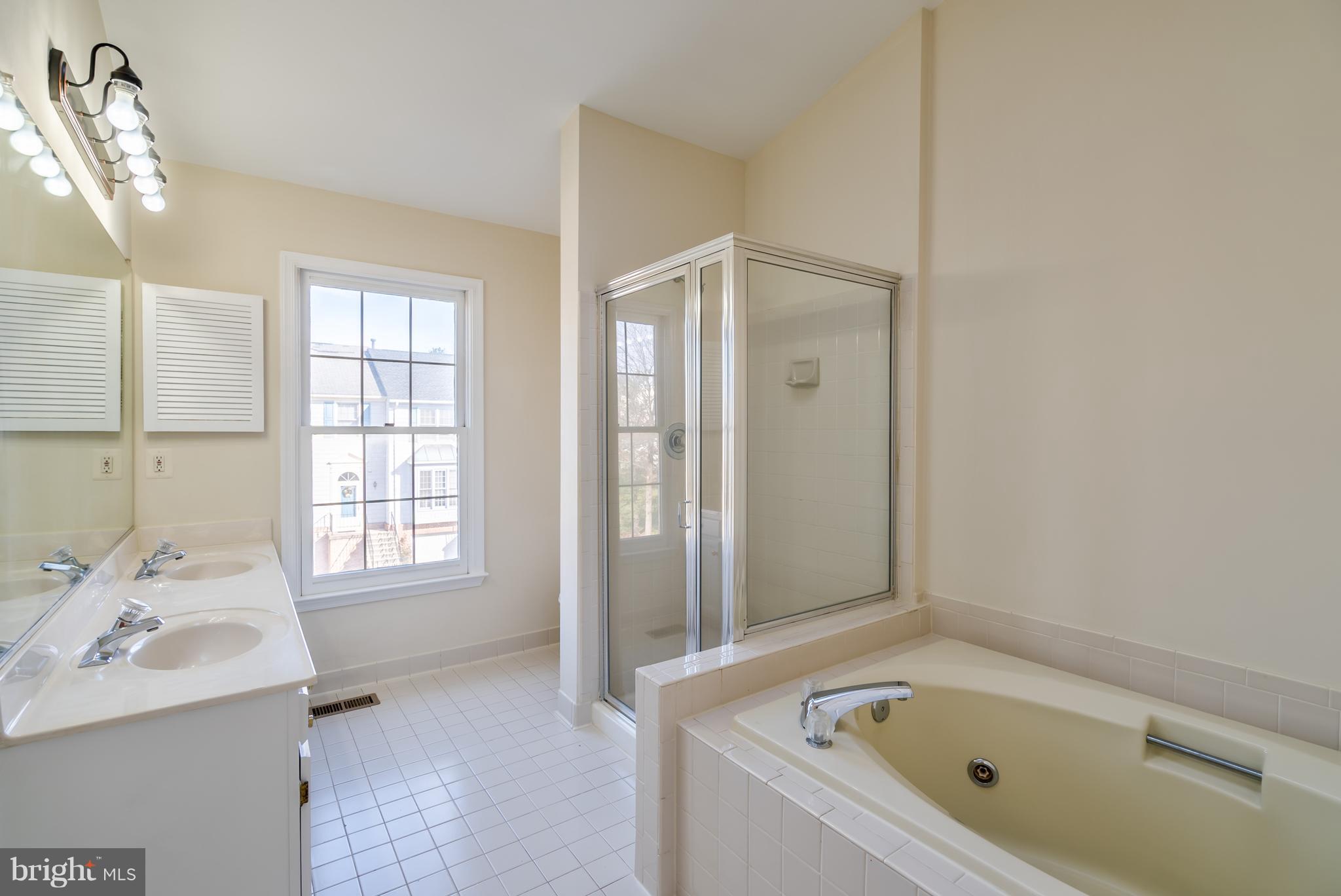 46869 Rabbitrun Terrace Sterling, VA 20164 - Photo 15 of 29 Dual Vanity, Tub & Shower in Master Bathroom