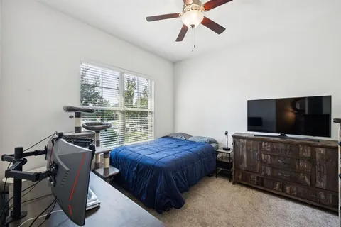 a bathroom with a sink a toilet a mirror and vanity