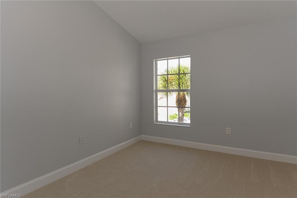 988 Hampton Circle Naples, FL 34105 - Photo 13 of 20 an empty room with a window