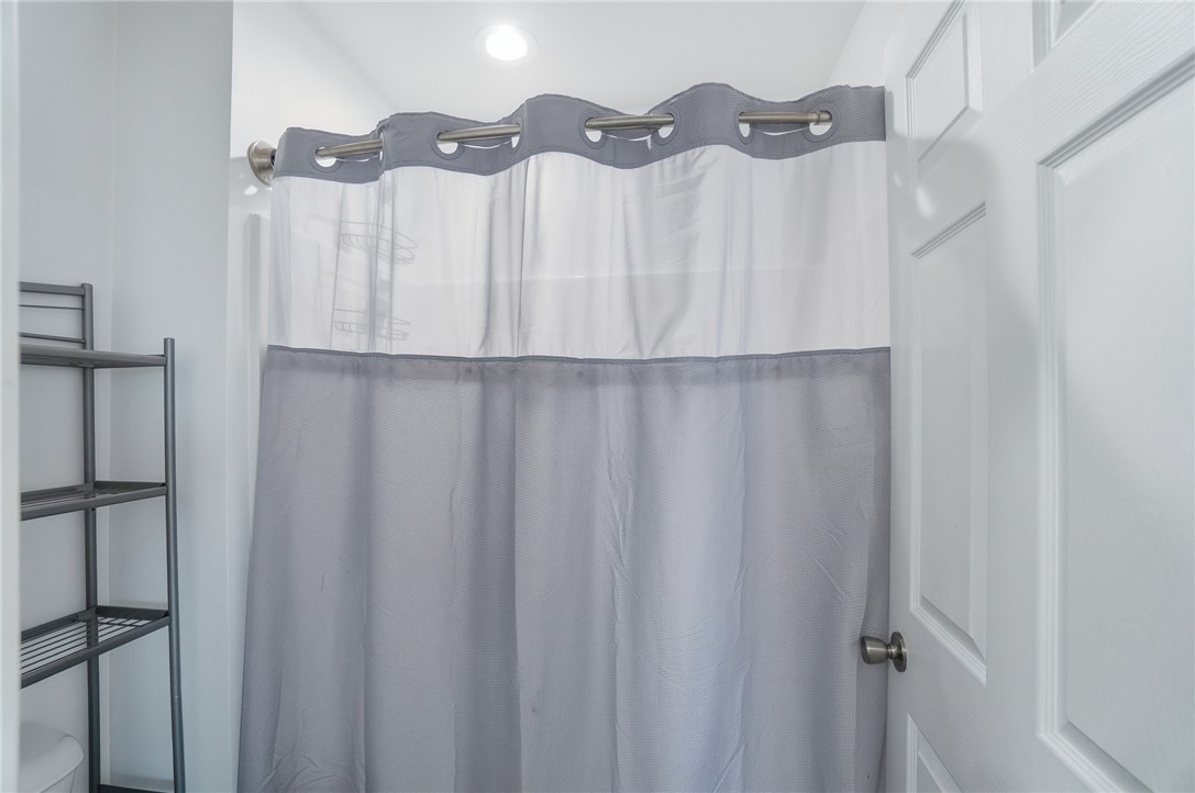 728 East Northern Avenue Springfield, OH 45503 - Photo 21 of 35 This bathroom features a contemporary shower curtain and convenient recessed lighting.