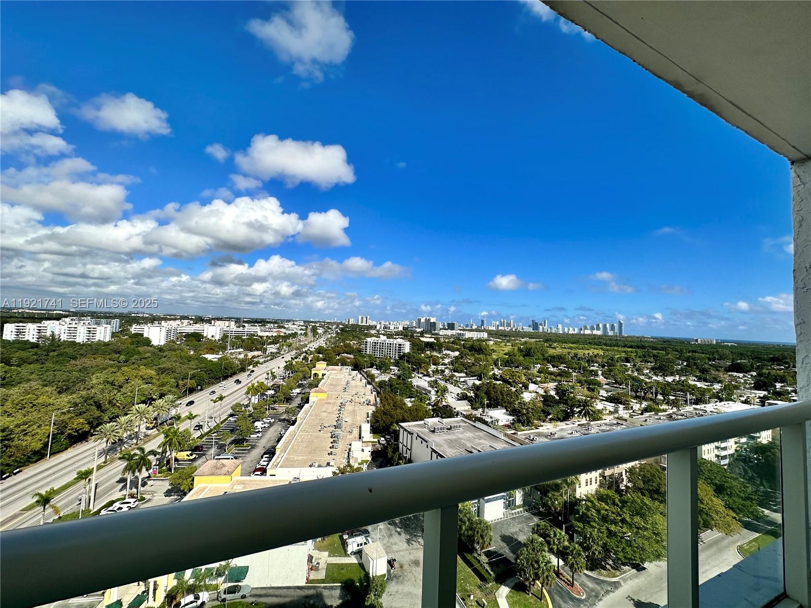 13499 Biscayne Boulevard, Unit PH1709 North Miami, FL 33181 - Photo 2 of 11 a view of city from a balcony