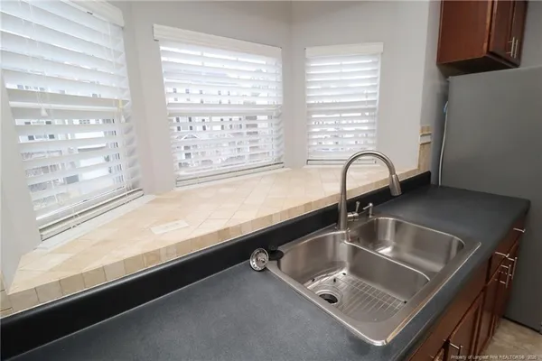 a room with a sink and a large window