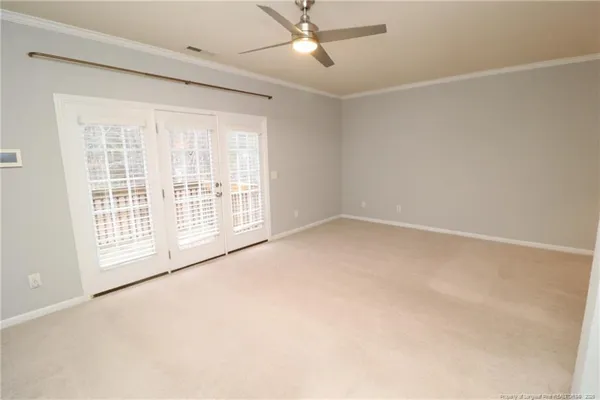 an empty room with a empty space and windows