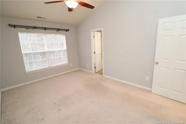 a view of an empty room with a window