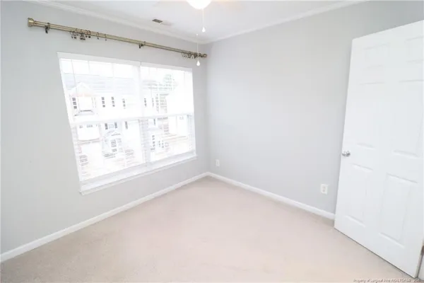 an empty room with a hallway