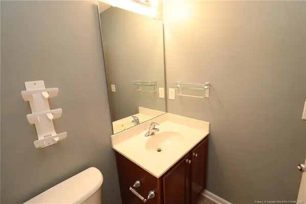 a white toilet sitting next to a bath tub