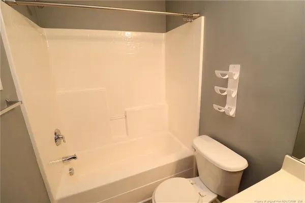 a view of balcony with wooden floor and fence