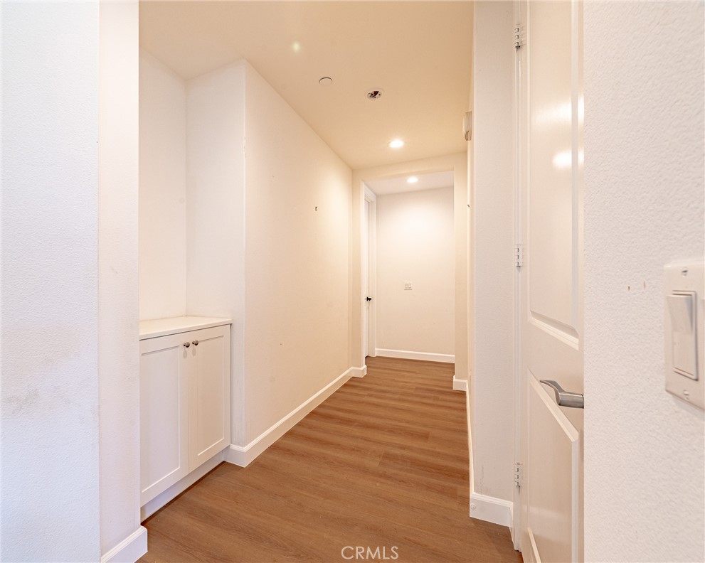 172 Follyhatch Irvine, CA 92618 - Photo 14 of 39 a view of a hallway with wooden floor