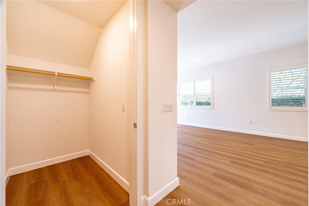 172 Follyhatch Irvine, CA 92618 - Photo 15 of 39 a view of an empty room with wooden floor and a window