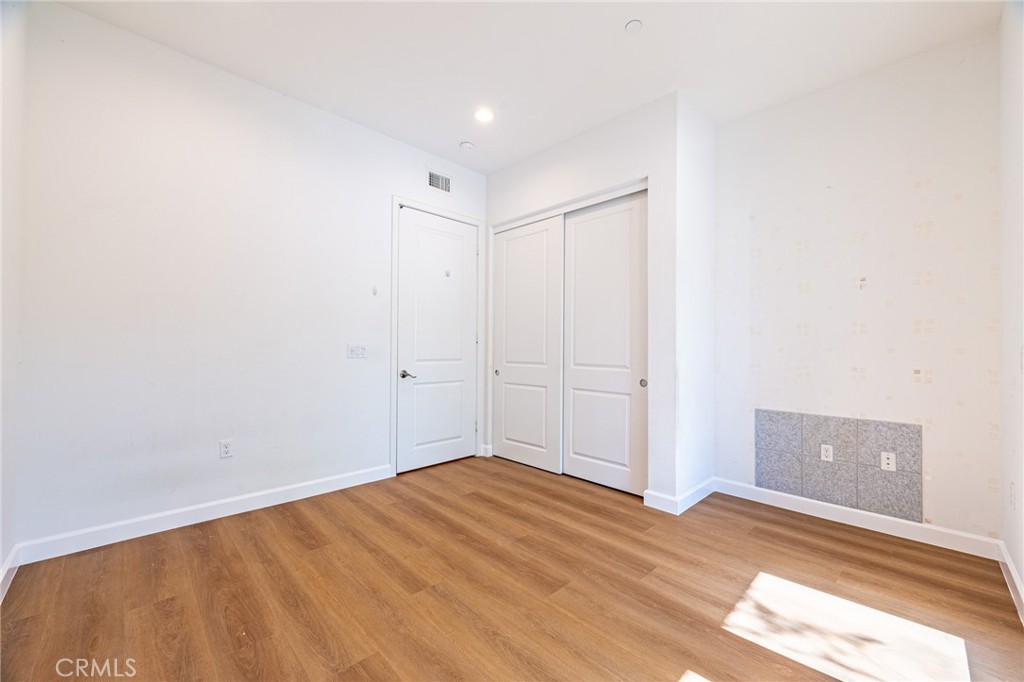 172 Follyhatch Irvine, CA 92618 - Photo 17 of 39 a view of a room with wooden floor