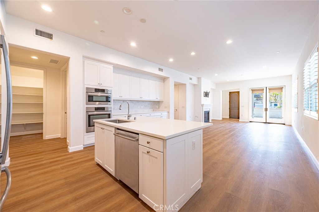 172 Follyhatch Irvine, CA 92618 - Photo 2 of 39 a kitchen with a stove and a wooden floors