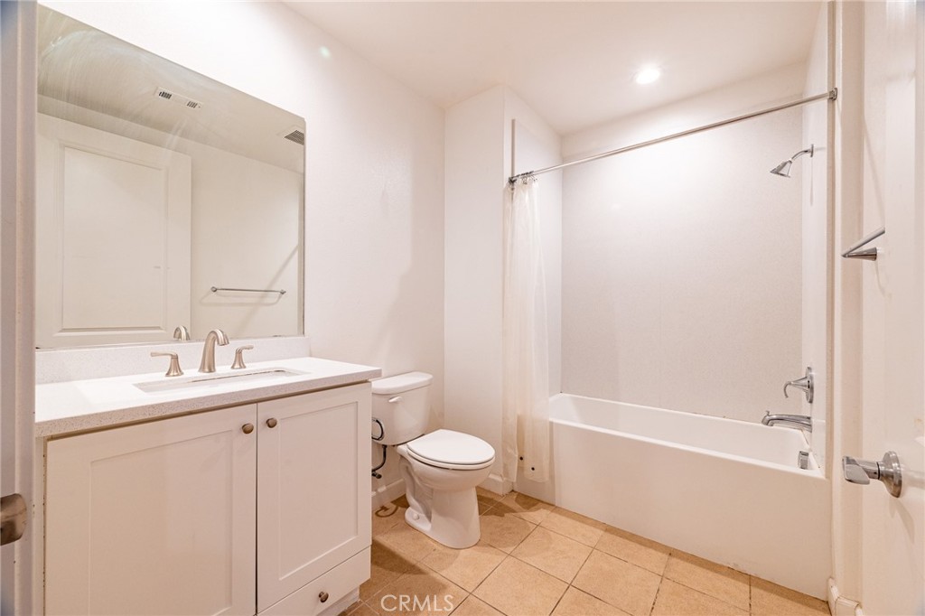 172 Follyhatch Irvine, CA 92618 - Photo 30 of 39 a bathroom with a sink toilet and shower