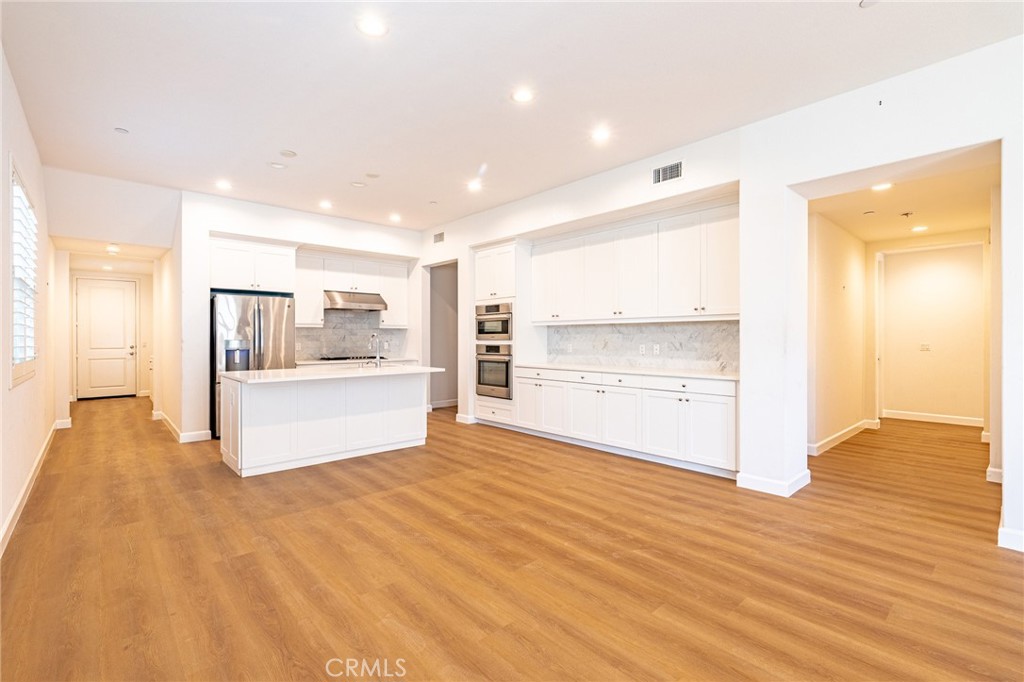 172 Follyhatch Irvine, CA 92618 - Photo 7 of 39 a view of large kitchen with wooden floor
